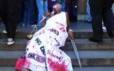 'Lady Justice' from POWA demonstrate's outside the Johannesburg High Court on 6 March, 2009. Picture: Taurai Maduna/Eyewitness News