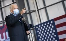 Democratic presidential nominee Joe Biden points to the crowd as he leaves a get-out-the-vote drive-in rally at Cleveland Burke Lakefront Airport on 2 November 2020 in Cleveland, Ohio. Picture: AFP.





