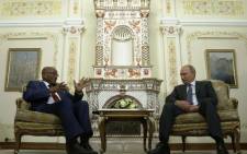 Russia's President Vladimir Putin (R) talks with his South African counterpart Jacob Zuma during their meeting at the Novo-Ogaryovo state residence outside Moscow, on 18 August 2014. Picture: AFP.