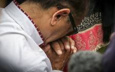 Anni Dewani Hindocha's father, Vinod Hindocha, kneels to pray at the shrine where her body was found in Lingelethu West, Khayelitsha. Picture: Thomas Holder/EWN