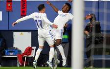Real Madrid's Spanish forward Lucas Vazquez (L) celebrates with Real Madrid's Brazilian forward Vinicius Junior after scoring his team's third goal during the Spanish League football match between CA Osasuna and Real Madrid CF at El Sadar stadium in Pamplona on April 20, 2022. Picture: Ander Gillenea / AFP
