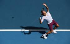 Switzerland's Roger Federer hits a return against Tennys Sandgren of the US during their men's singles quarter-final match on day nine of the Australian Open tennis tournament in Melbourne on 28 January 2020. Picture: @AustralianOpen/Twitter 