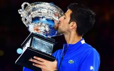 Novak Djokovic with his prize after winning the 2019 Australian Open. Picture: @AustralianOpen/Twitter
