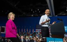 FILE: US President Barack Obama speaks at a campaign event for Democratic presidential candidate Hillary Clinton (L) in Charlotte, North Carolina, on 5 July, 2016. Picture: AFP.