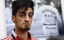 This file photo taken on 24 March 2016 shows Belgian Taekwondo athlete Mourad Laachraoui, younger brother of Brussels attacks suspect Najim Laachraoui, giving a press conference at the headquarters of the Francophone Belgian Taekwondo Association in Ukkel,Brussels. Picture: Emmanuel Dunand/AFP.