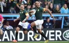 JP Pietersen (R) scores his first of three tries during the Pool B match of the 2015 Rugby World Cup between South Africa and Samoa at Villa Park in Birmingham on September 26, 2015. 