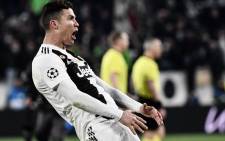 FILE: Juventus' Portuguese forward Cristiano Ronaldo celebrates after scoring 3-0 during the Uefa Champions League round of 16 second-leg football match Juventus vs Atletico Madrid on 12 March 2019 at the Juventus stadium in Turin. Picture: AFP