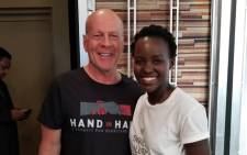 Lupita Nyong'o pictured with  Bruce Willis at the Hand in Hand: A Benefit for Hurricane Relief event. Picture: @Lupita_Nyongo