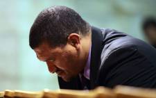 FILE: Marius Fransman bows his head during a prayer vigil at St Georges Cathedral in Cape Town on 27 June 2013. Picture: AFP.