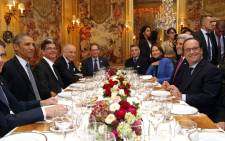 President Barack Obama (L) and French President Francois Hollande (R) have dinner at the Ambroisie restaurant in Paris, with Secretary of State John Kerry (2nd R), French Minister for Ecology, Sustainable Development and Energy Segolene Royal, (3rd R) and French Foreign Minister, Laurent Fabius, (2nd L) as part of the COP21 World Climate Change Conference in Le Bourget, north of Paris, on 30 November, 2015. Picture: AFP.
