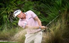 FILE: Keegan Bradley blasts his way out of a sandtrap on his way to saving par. Picture: www.keeganbradley.com.