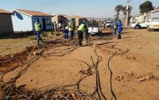 City Power officials on 3 June 2020 disconnected illegal electricity connections at Phumula Mqashi informal settlement in Vlakfontein. The officials were joined by JMPD and SAPS officers. Picture: @CityPowerJhb/Twitter. 