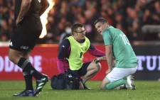 Johnny Sexton of Ireland receives medical attention for his injury during the rugby Test match between the New Zealand All Blacks and Ireland at Eden Park in Auckland on 2 July 2022. Picture: MICHAEL BRADLEY/AFP