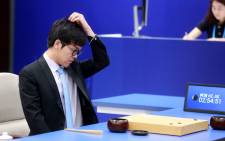 China's Go player Ke Jie reacts during the first match against Google's artificial intelligence program AlphaGo. Picture: AFP