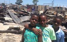 The victims of the Khayelitsha shack fires wait for aid on 2 January 2013. Picture: Giovanna Gerbi/EWN