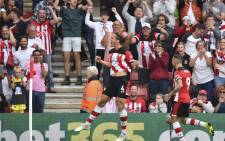 Southampton's Danish defender Jannik Vestergaard (L) celebrates scoring their first goal to equalise 1-1 during the English Premier League football match between Southampton and Manchester United at St Mary's Stadium in Southampton, southern England on 31 August 2019. Picture: AFP.
