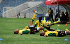 Bafana players stretch at a training session at the Orlando Stadium in Soweto on Friday, 11 January 2013. The team will play a friendly match against Algeria at the venue on Saturday. Bafana Bafana face the Cape Verde Islandsin the African Cup of Nations opener at the National Stadium on January 19.Picture: Werner Beukes/SAPA