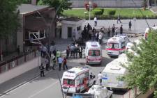 Ambulances are parked outside the police headquarters in the southeastern Turkish city of Gaziantep on May 1, 2016 after a bomb exploded, killing at least one police officer. Picture: AFP."