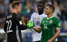Germany’s goalkeeper Marc-Andre Ter Stegen shakes hands with Mexico's forward Javier Hernandez after the 2017 Confederations Cup semi-final football match between Germany and Mexico at the Fisht Stadium in Sochi on June 29, 2017. Pictured: AFP