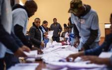 IEC officials count ballots at the Brixton Recreational Centre voting station in Brixton, Johannesburg on 8 May 2019. Picture: AFP