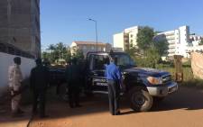 Malian security forces take position near the Radisson Blu hotel in Bamako on 20 November 2015 where a hostage situation is underway. Picture: AFP.