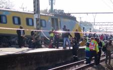Paramedics and emergency services rush to help those trapped inside the two trains that collided at Denver Station, south east of Johannesburg on 28 April 2015. Picture: Louise McAuliffe/EWN.