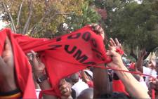 Anti-Zuma protesters tear a supporters T-shirt at the Cosatu Workers Day rally in Bloemfontein.Picture: Kgothatso Mogale/EWN