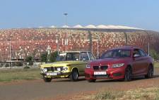 The new BMW M235i alongside its predecessor the 2002, Picture: Vumani Mkhize/EWN.