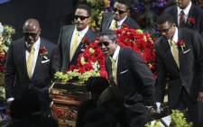 Pop singer Michael Jackson's casket is carried by family relatives after a service in his memory. Picture: AFP