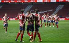 Atletico Madrid's players celebrate at the end of the Spanish League football match between Club Atletico de Madrid and FC Barcelona at the Wanda Metropolitano stadium in Madrid on 21 November 2020. Picture: @atletienglish/Twitter 