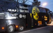 Borussia Dortmund’s damaged bus is pictured after an explosion some 10km away from the stadium prior to the Uefa Champions League 1st leg quarter-final football match BVB Borussia Dortmund v Monaco in Dortmund, western Germany on 11 April 2017. Picture: AFP.