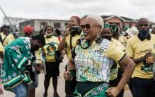 An ANC supporter dances and sings in KwaMakhutha township, south of Durban, on 9 October 2021. Picture: AFP