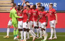 Manchester United midfielder Jesse Lingard (3R) celebrates scoring their second goal with team-mates during the English Premier League football match between Leicester City and Manchester United at King Power Stadium in Leicester, central England on 26 July 2020. Picture: AFP