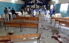 Blood stains are seen on the floor as Kenyans inspect the site of a deadly attack at a church in the coastal city of Mombasa on March 23, 2014. Picture: AFP.