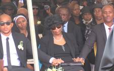 Jackie Selebi's wife Anne is comforted by her sons during her husband's funeral, Picture: Vumani Mkhize/EWN.