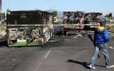 Torched Golden Arrow buses in Nyanga, Cape Town on Monday, 1 September 2014. It's believed to be related to protesting taxi drivers. Picture: Sapa.