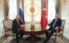 FILE: This handout photo released by the Turkish President's press office shows Turkish President Recep Tayyip Erdogan (R) and Russian President Vladimir Putin (L) posing before their meeting at the Presidential Palace in Ankara, on 16 September 2019. Turkish President Erdogan, Russian President Putin and Iranian President Rouhani are in Ankara for a trilateral meeting for Syria talks. Picture: AFP.

