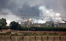 Smoke billowing from the coastal Palestinian enclave during shelling by the Israeli army on 22 July, 2014. Picture: AFP.