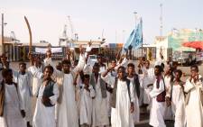 Sudanese protesters gather outside the main entrance to the southern port in Port Sudan on September 20, 2021. Picture: AFP
