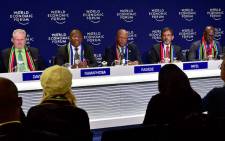 Deputy President Cyril Ramaphosa, flanked by ministers Rob Davies, Jeff Radebe, Ebrahim Patel and Malusi Gigaba, addresses a media conference at the end of his engagements at the World Economic Forum 2018 annual meeting in Davos, Switzerland. Picture: GCIS