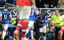 Everton's forward Romelu Lukaku celebrates with team manager, Roberto Martinez in their Premier League match against Arsenal at Goodison Park on 6 April 2014. Picture: Facebook.