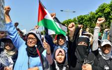 FILE: Women chant slogans and gesture as they march with Palestinian flags during a demonstration in the Moroccan capital Rabat on 23 June 2019. Picture:AFP