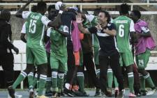FILE: Turkish head coach of Kenya's Gor Mahia, Hassan Oktay (3rd-R) celebrates with players after a goal against Egypt's Zamalek during their CAF Confederation cup at Kasarani Stadium in Nairobi, Kenya, on 3 February 2019. Picture: AFP