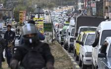 Tourists’ vehicles struck toward the tourist resort Murree on the outskirts of Islamabad on 8 January 2022. Picture: AFP