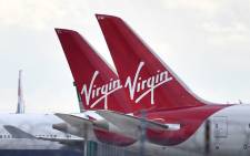 Virgin Atlantic passenger aircraft are pictured on the apron at Heathrow Airport, west of London on 2 April 2020. Picture: AFP