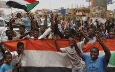Sudanese people celebrate in the streets of Khartoum after ruling generals and protest leaders announced they have reached an agreement on the disputed issue of a new governing body on 5 July 2019.  Picture: AFP
