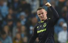 FILE: Everton's English striker Wayne Rooney celebrates scoring his team's first goal during the English Premier League football match between Manchester City and Everton at the Etihad Stadium in Manchester, North West England, on 21 August 2017. Picture: AFP.