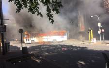 FILE: A bus has been set alight during Fess Must Fall protests as Wits students continue protesting. Picture: Clement Manyathela/EWN.