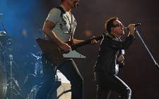 U2's The Edge (with guitar) and Bono performing at the band’s 360° Tour concert at FNB Stadium on Sunday February 13 2011. Picture: Taurai Maduna/EWN.