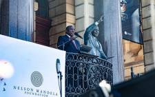 President Cyril Ramaphosa speaking on Cape Town's City Hall balcony at the 30th-anniversary parade of the release of former president Nelson Mandela who was jailed for 27 years. Picture: Kayleen Morgan/EWN